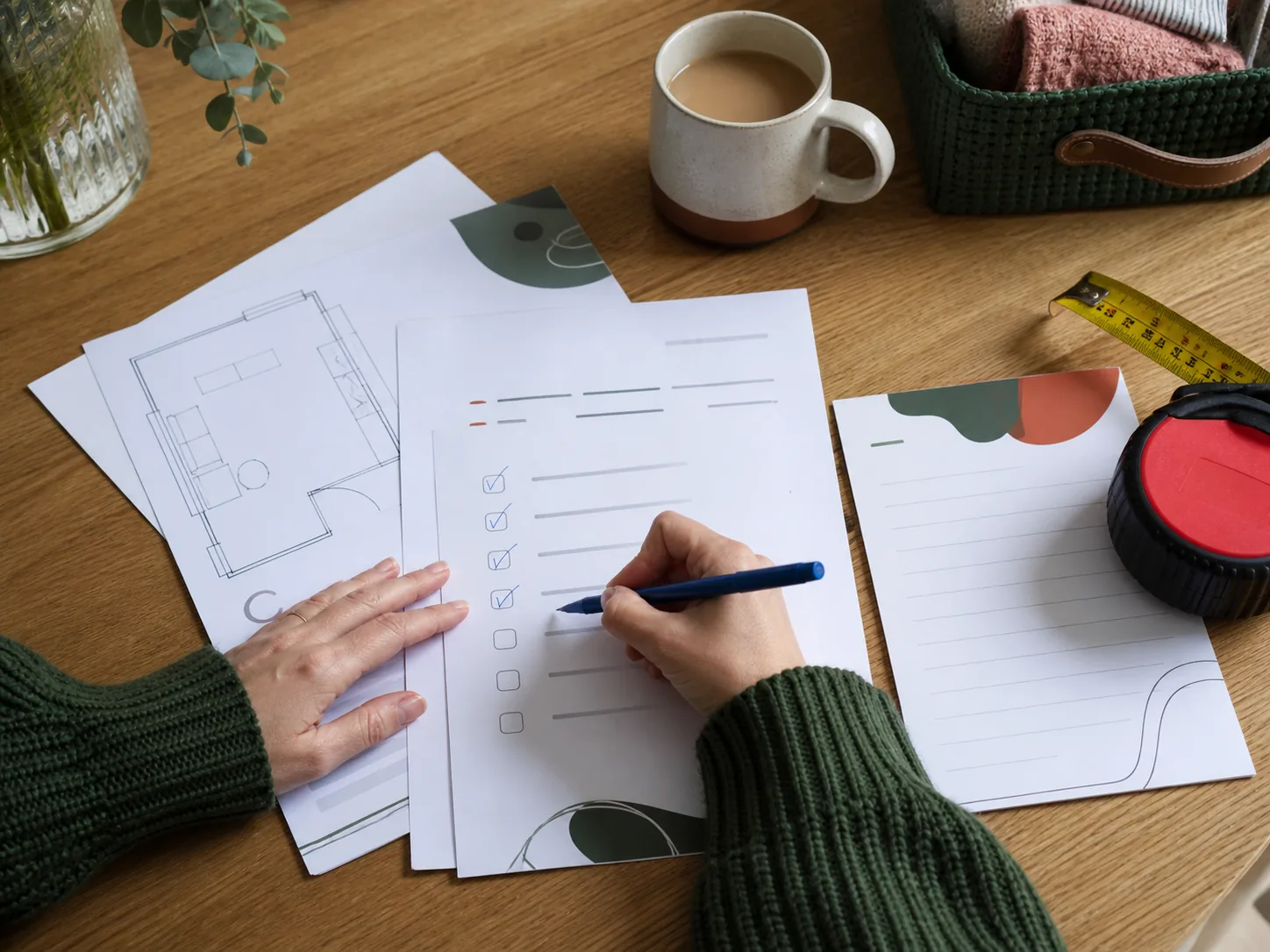 Hands using a printed room-reset checklist at a table